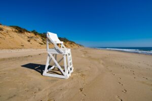 A picture of a lifeguard chair on a beach in Cape Cod